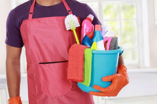 Carpet cleaner preparing equipment before a safe cleaning job