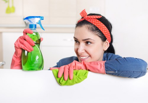 Cleaning staff handling carpet cleaning chemicals safely